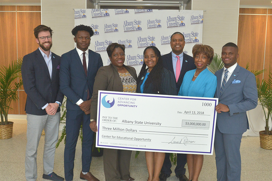 Representatives from the Thurgood Marshall College Fund’s Center for Advancing Opportunity and the Charles Koch Foundation present Albany State University with a $3 million check to establish the Center for Educational Opportunity.
