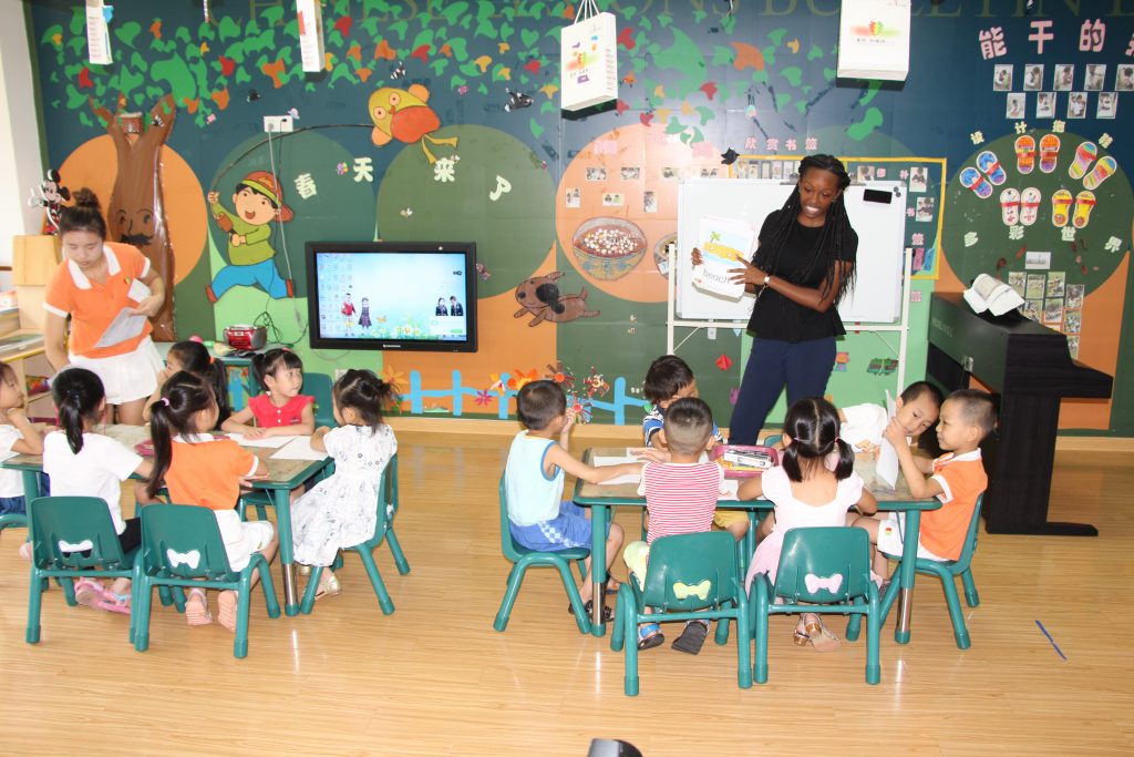 ASU alumna Alex Merrilles teaches Chinese students while visiting a bilingual kindergarten class in Xiamen, China during a previous summer study abroad trip.